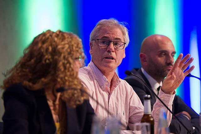 Panel speakers deep in discussion at the International Congress. 